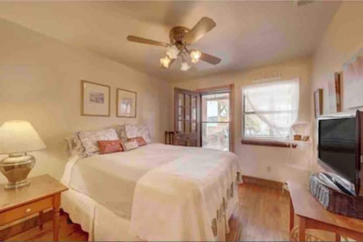 Lower floor bedroom with private exit to downstairs patio