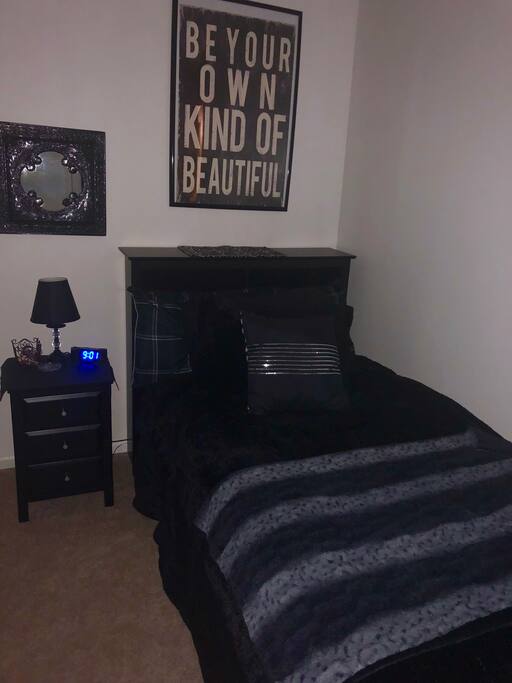 Room has window with room darkening curtains did day sleepers.