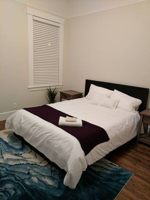 The master bedroom has a queen bed, a comfy chair, a large walk-in closet and an ensuite bathroom.