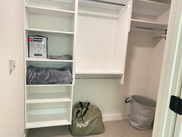 Walking closet with king size air mattress.