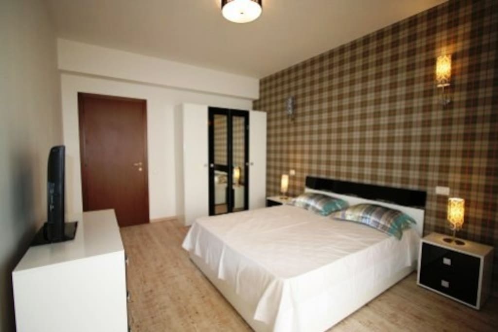 The bedroom is very spacious and is equipped with a king size bed.