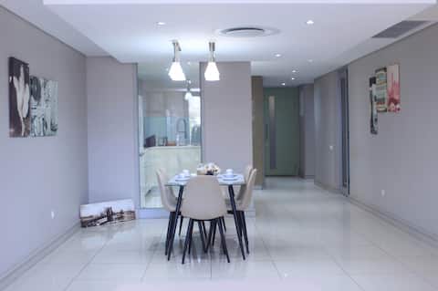 Upscale Sun-Soaked Luxury apartment on the beach.