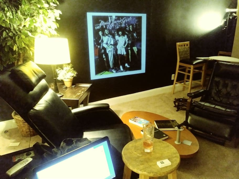 Lounge/living area with tv, projector and in wall bluetooth speaker system