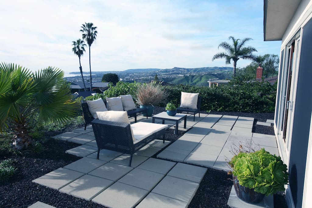 The patio offers an outdoor retreat with comfortable seating and an ocean view.
