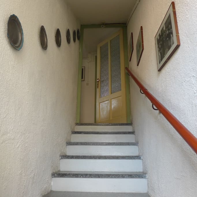 after the entrance door you walk up these stairs to the flat