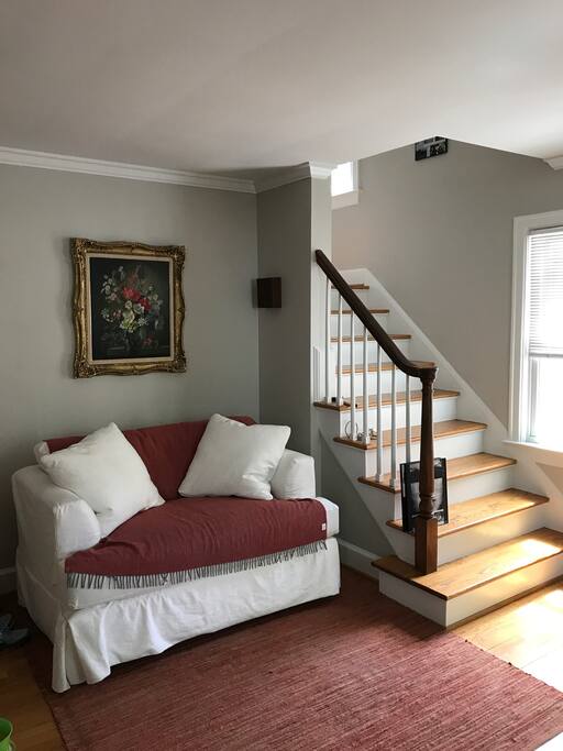 A cozy loveseat, perfect to read and relax.