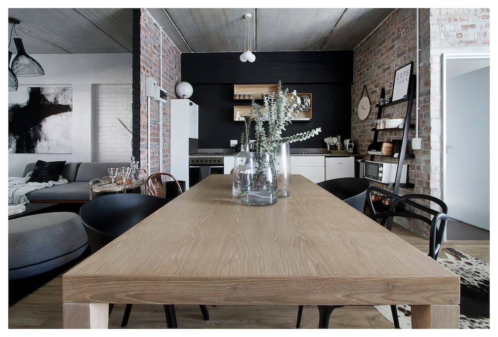 Dining table in fully equipped modern kitchen includes microwave, Nespresso Coffee machine with complimentary coffee pods, complimentary cereals x 3 and Nutribullet Juicemaker