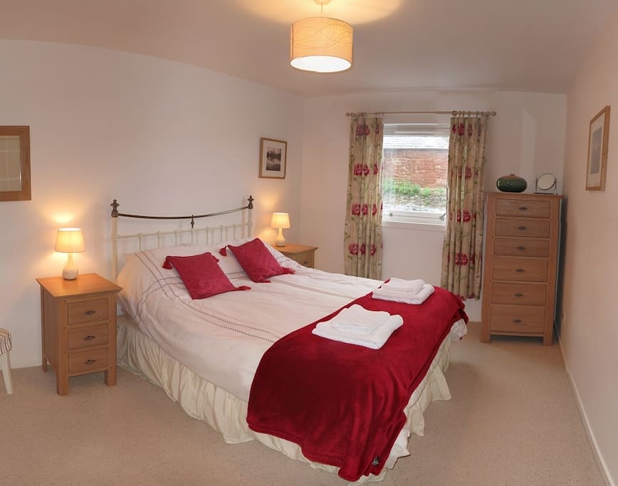 comfortable kingsize bed. Walk in wardrobe and quiet aspect.