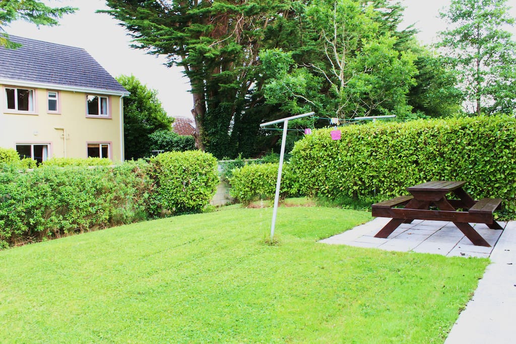 back garden of
house with bench
