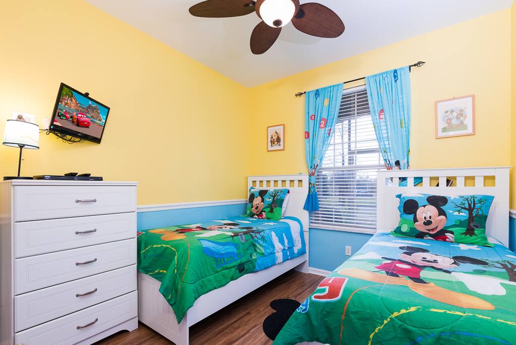 It features two twin beds and their own TV