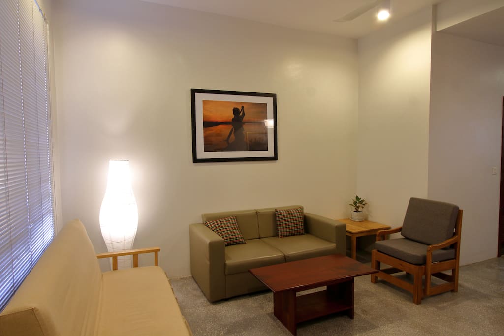 Living room is airy and clean and comfortably seats 5 people. Has cable tv with 96 local and international channels.