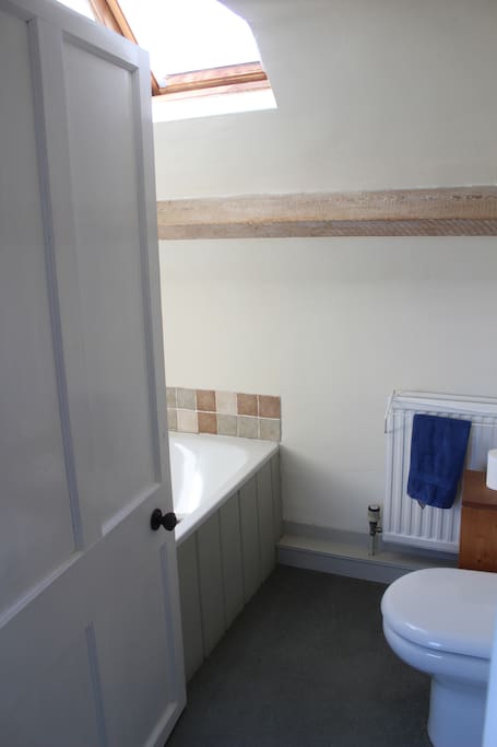 Private, cosy bathroom with bath