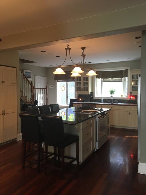 Bright modern kitchen with granite countertops.