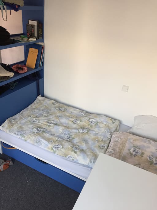 Single bed upstairs with shelves (which will be empty) and desk