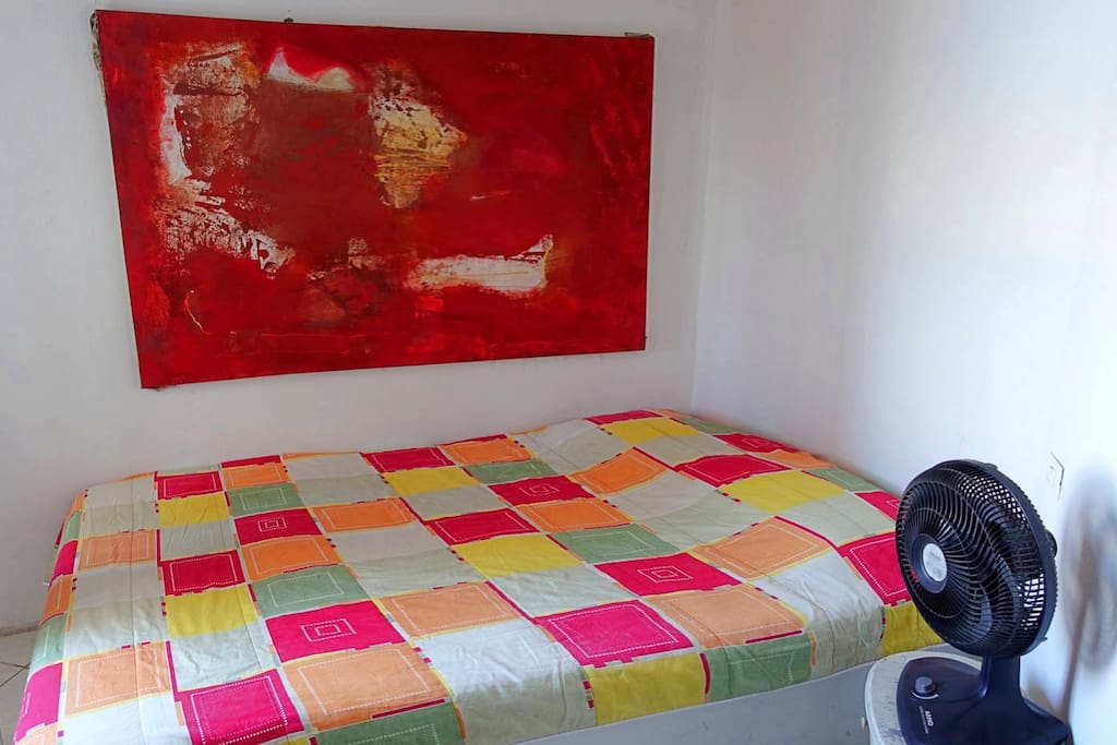 Double room with art work on the wall