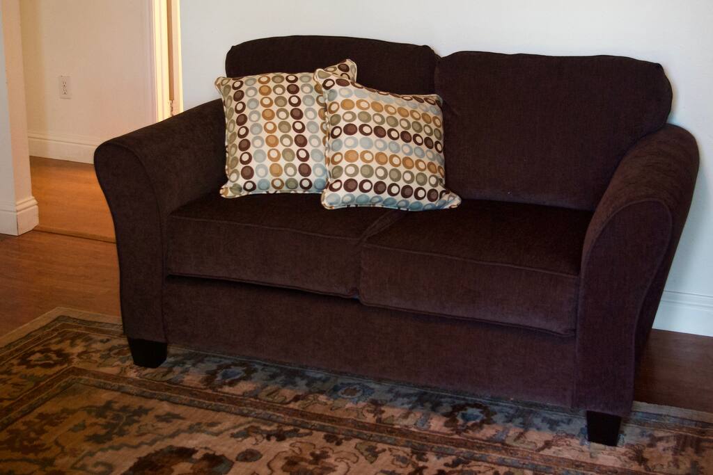 There is also another full size couch in addition to the one pictured.