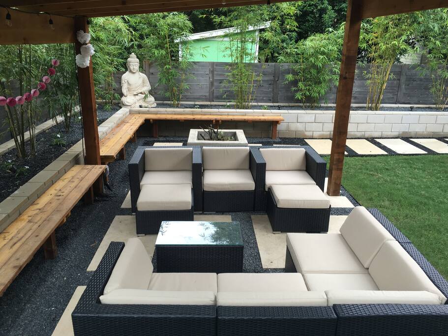 Covered seating with misters under the metal roof pergola