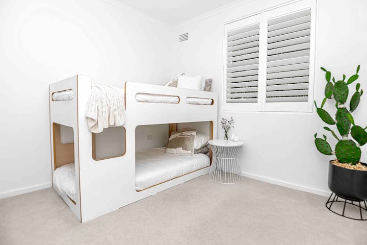 Charm of the 'our place' bunk beds, designed with high-quality finishes  to this fun-filled bedroom. These single bunks offer a delightful sleeping arrangement for children, creating a space where imagination and adventure can thrive. 