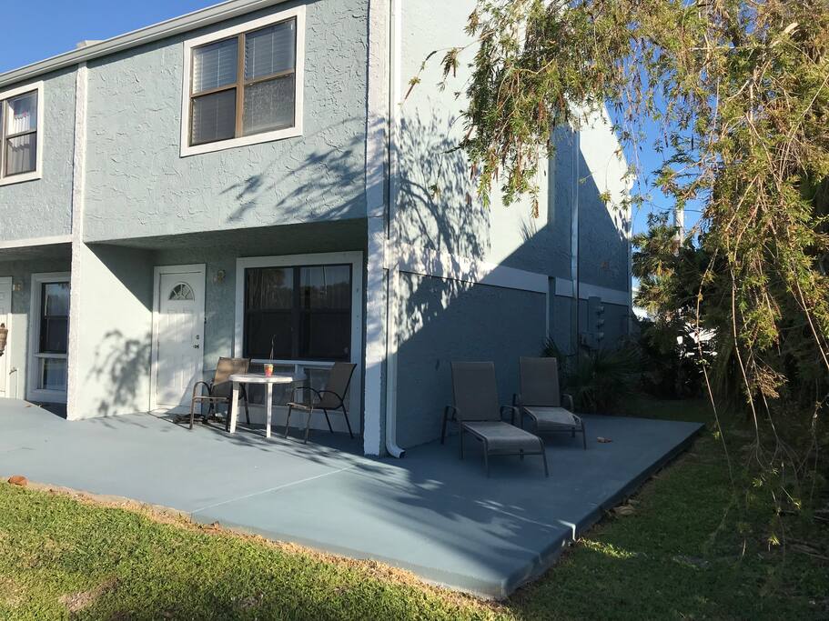 Front porch with table and chairs.