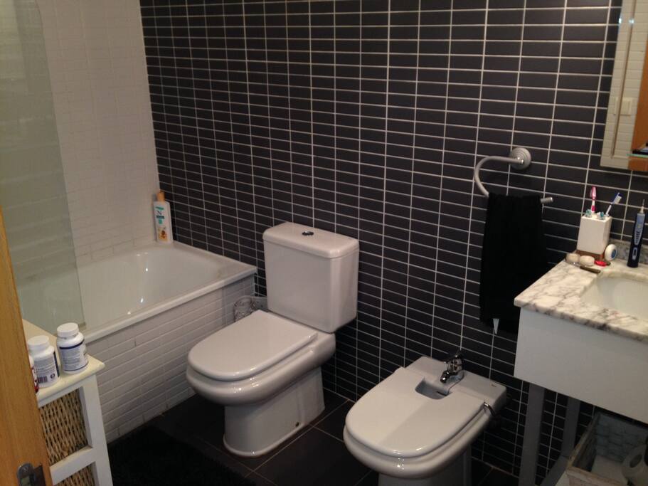 Master bedroom en-suite bathroom with bath and shower over