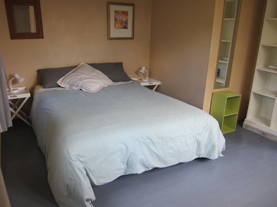 Main bedroom with comfy queen bed.