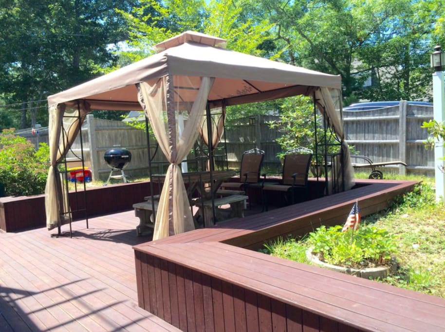 Deck with netted gazebo.