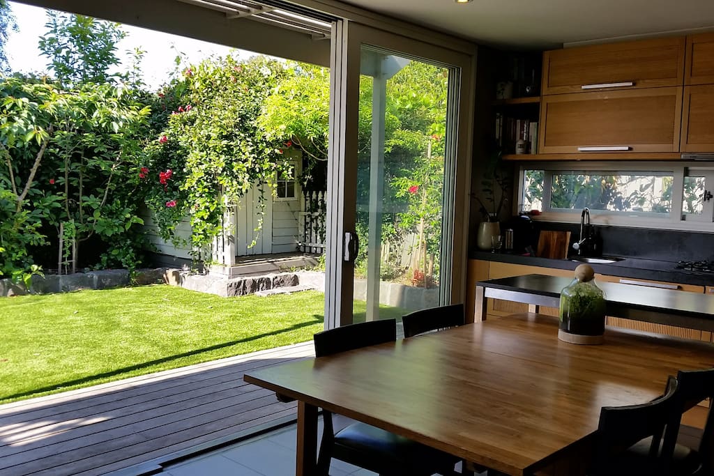 Kitchen opens onto deck & sun-bathed north facing backyard