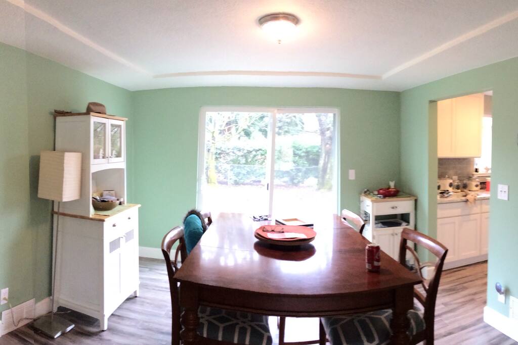 Dining room. Doors open to giant back yard.