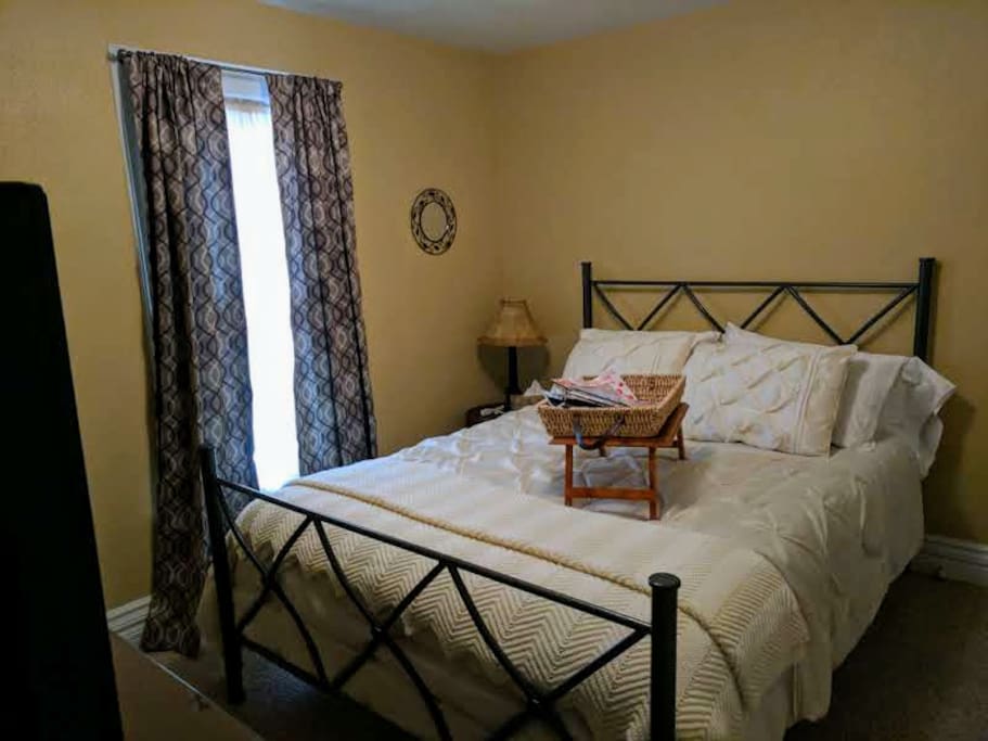 Queen size bed & full closet in bedroom.