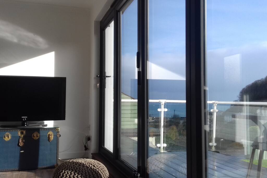 View through the new bifold doors to the living room means that you don't even have to go out