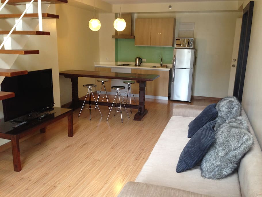 with flat screen tv and long wooden table