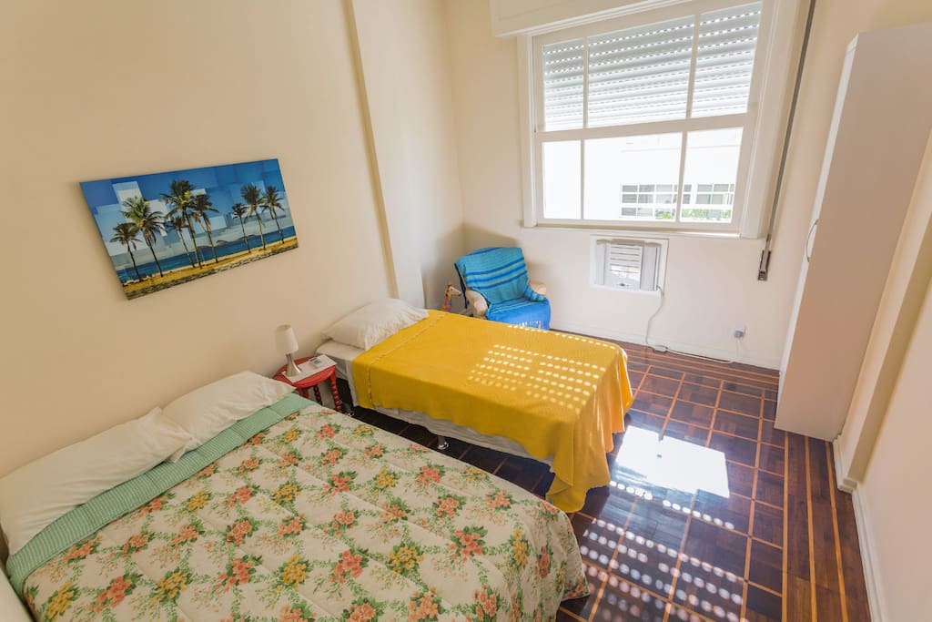 This is your room! One double bed + one single bed, A/c, armchair, wardrobe and beach view!