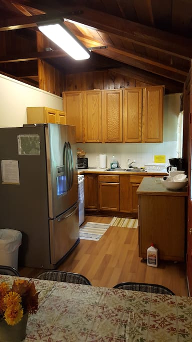 Kitchen with full oven and fridge/freezer