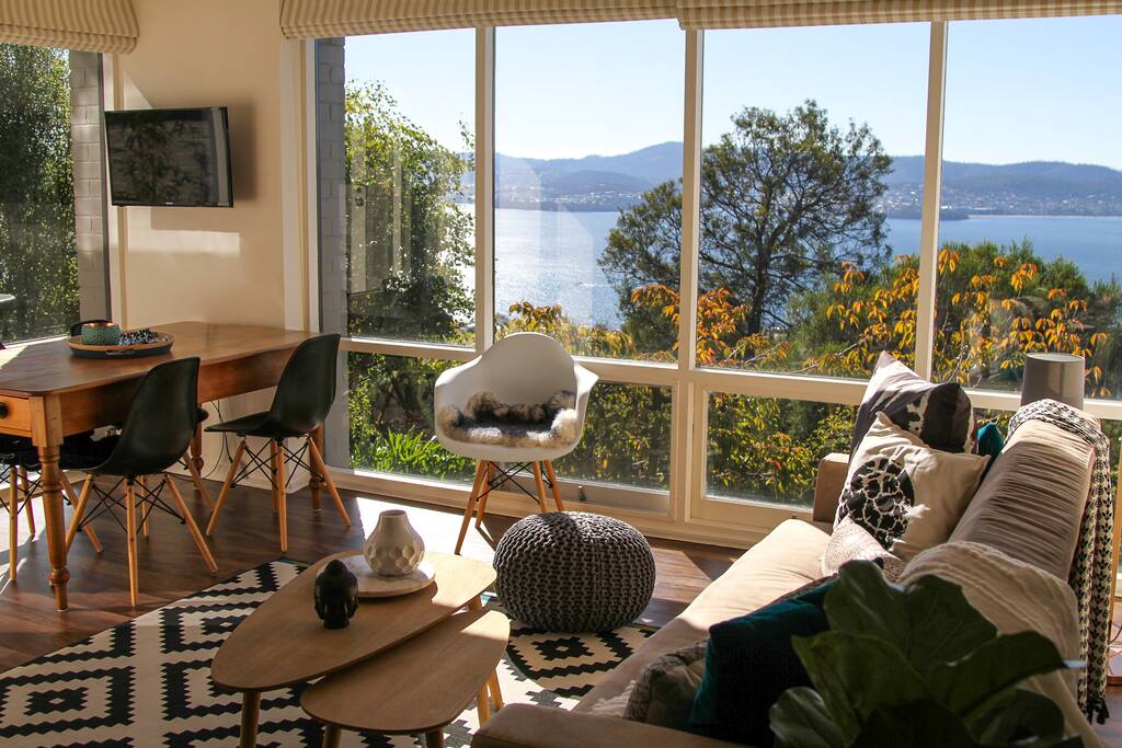 The living area with dining table and Smart TV