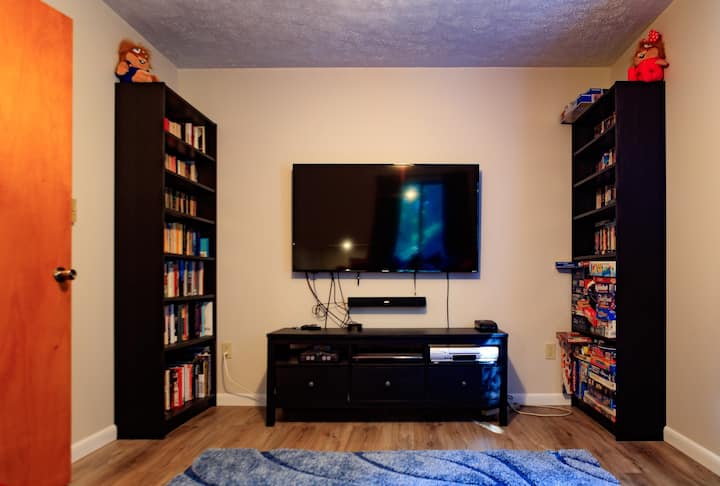 Our 'retro' entertainment room on the main floor - Nintendo 64, Blu-ray/DVD player, VHS player and tons of movies, board games, books...