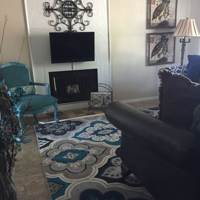 Enjoy this spacious living area after a day at the beach or work. Unfortunately, our sofa is not a sleep sofa.