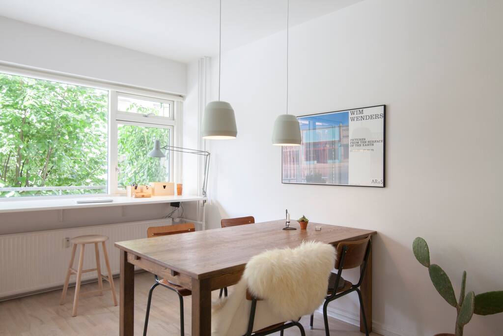 Living room. Dining area. The desk by the window creates a nice and bright workspace.