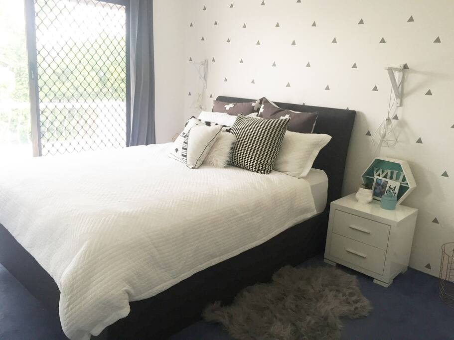 Main bedroom with ocean views from balcony and ensuite bathroom.