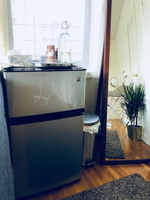 A small fridge for keeping your drink and food.
