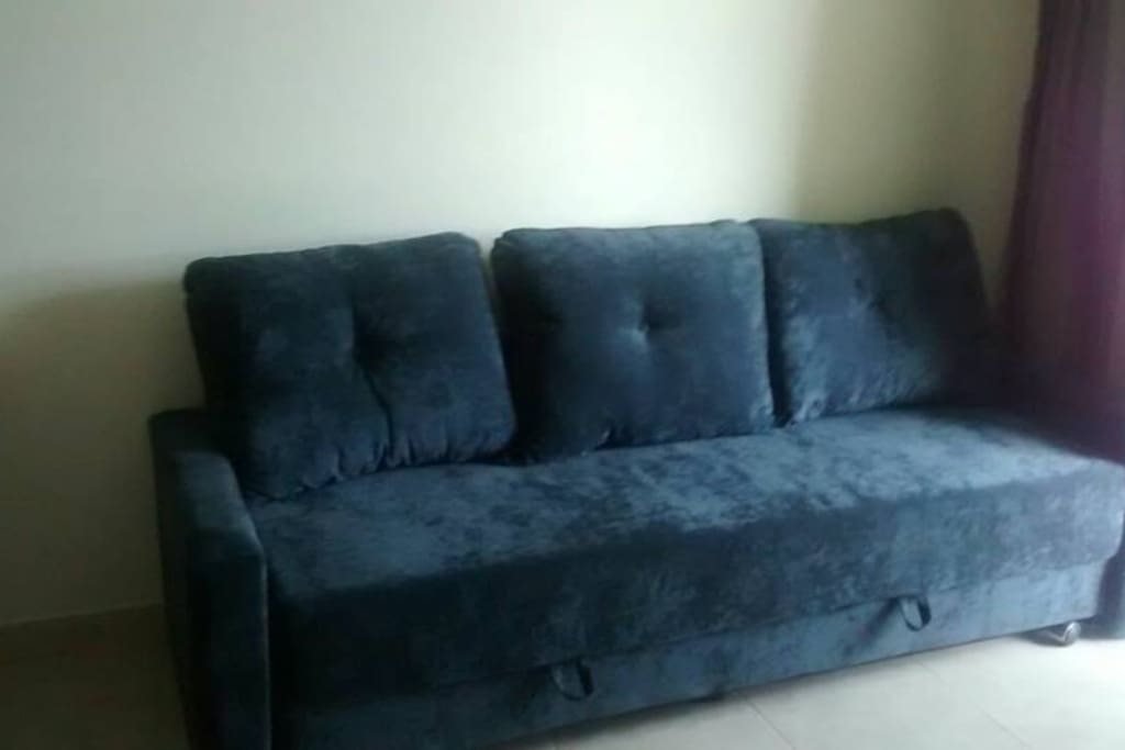 Sala com sofá cama