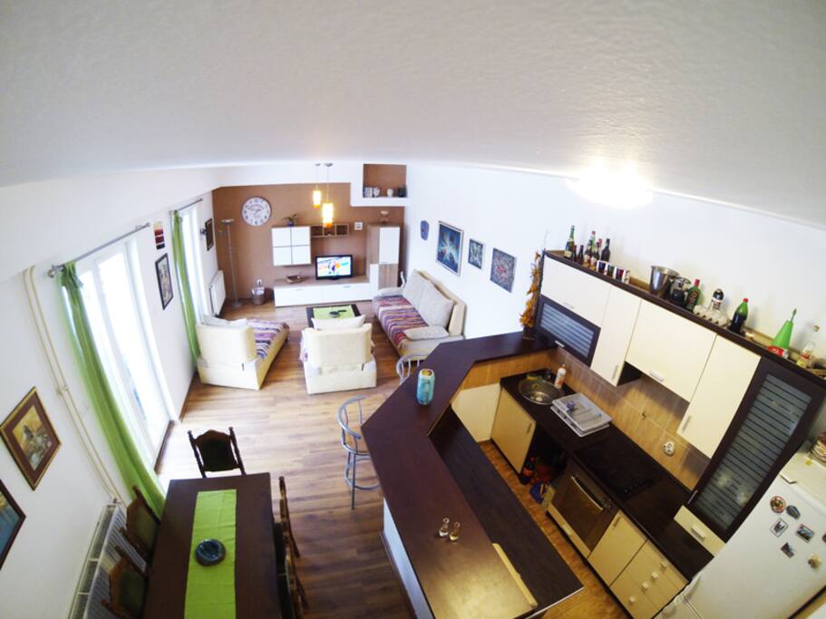 Living room with kithchen. Wait until you see our new BARBECUE.