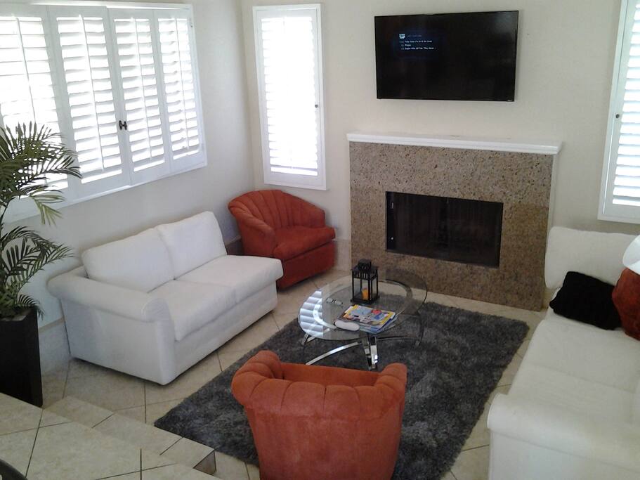 Living room 1 off of kitchen for guests to visit those in the kitchen