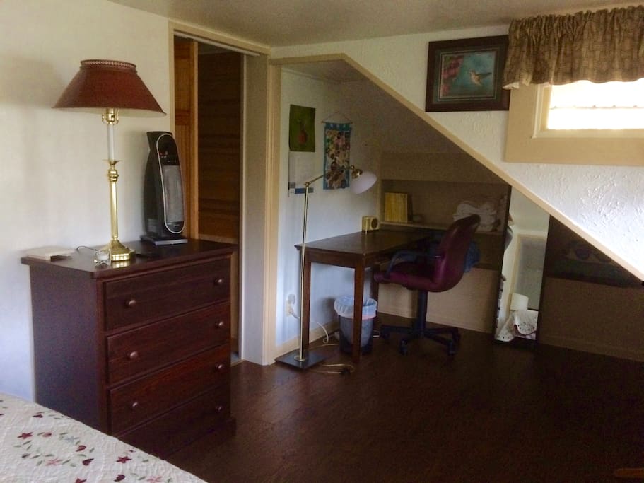 Bedroom 1. Desk, chair, dresser, full-length mirror. Large windows for good light.