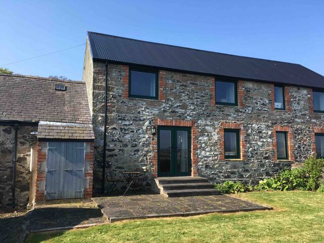 Idyllic converted barn with sea views