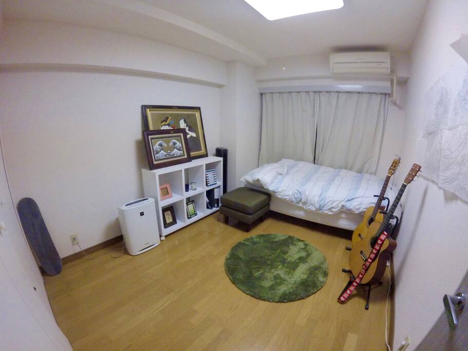 Bedroom . this time is at night but in the morning ,here is bright room like a living room too.