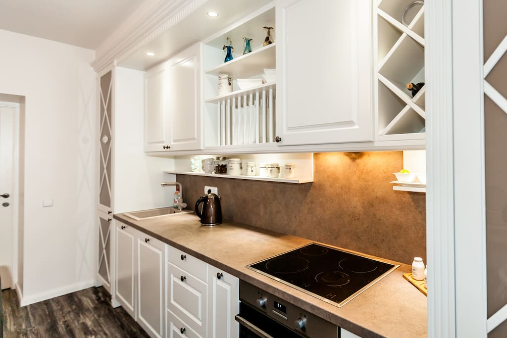 Integrated fridge-freezer, stove, oven, wine rack,plates etc