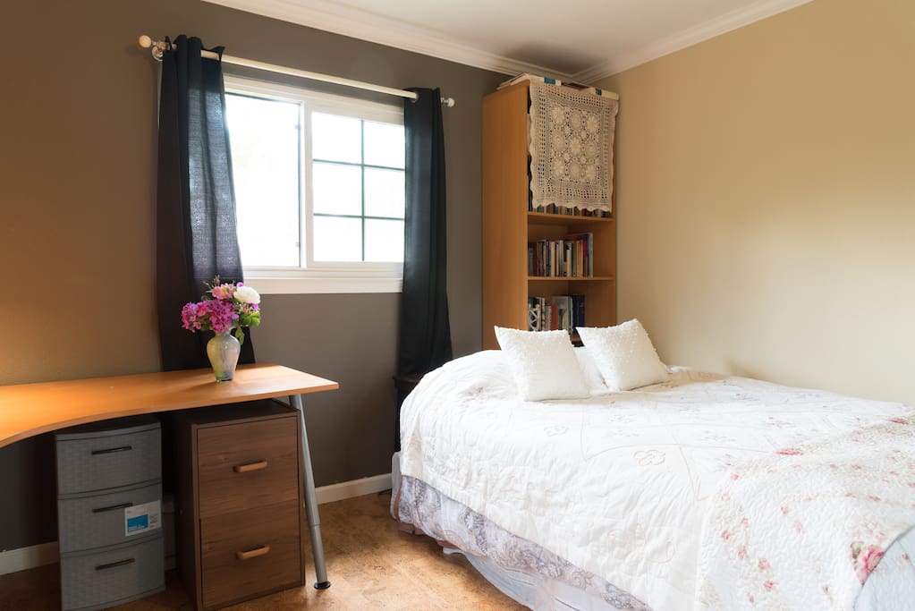 Your quiet room with real bed, (queen size). Large desk, office chair, bookshelves, large closet, two windows.
