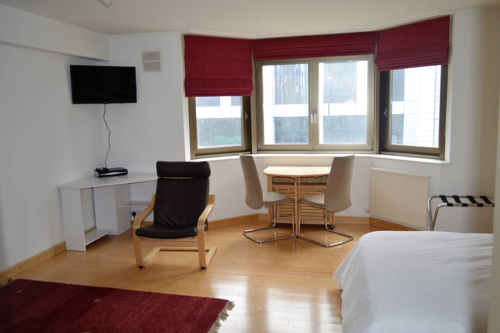 Dining table and 4 chairs. Sky TV. Desk.