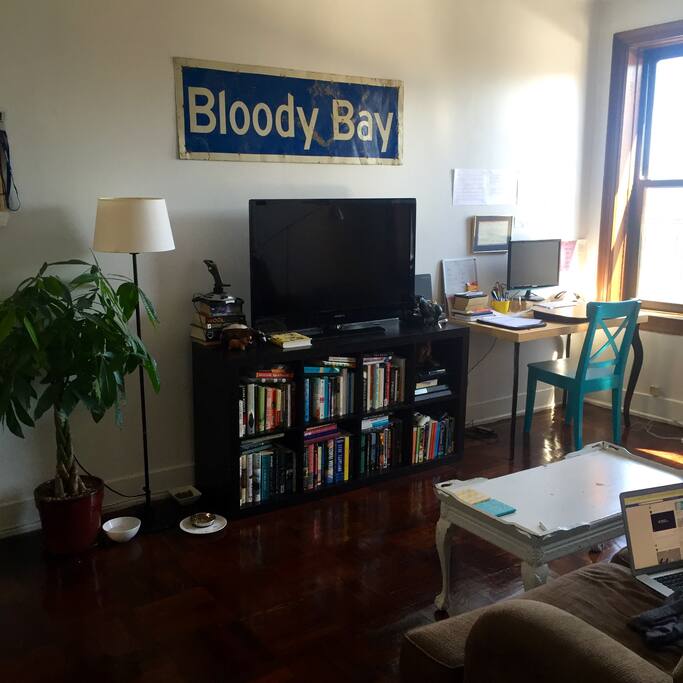 Spacious living room with a/c unit