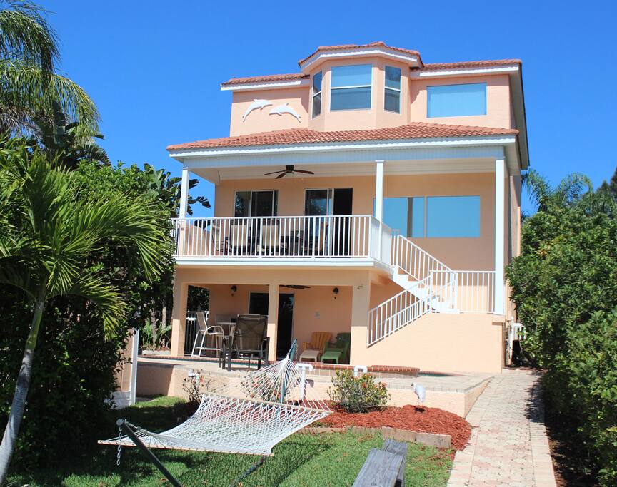 This is the back of the home from the private boat dock